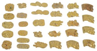 Japanese gilt metal menuki sword furniture and 19th century Chinese mother of pearl gaming counters