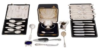 A cased George V silver twin handled christening cup and a quantity of silver