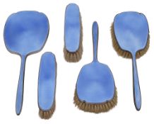 A George V silver and blue guilloche enamel five piece dressing table set
