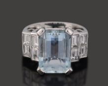 An aquamarine and diamond-set ring