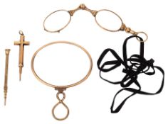A 19th century gold propelling pencil, a gilt pencil, a pair of gilt framed folding sprung lorgnette