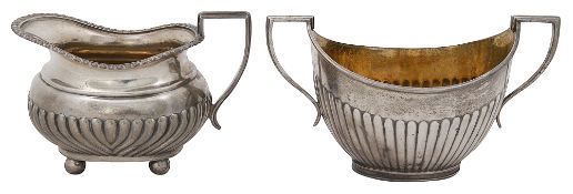 A Late Victorian silver cream jug and and a twin handled sugar basin