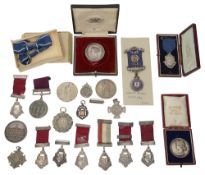 A collection of Victorian and later silver and other prize medals and medallions