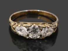 A late Victorian diamond three stone ring