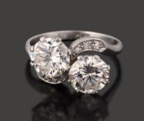 A diamond two stone cross-over ring