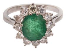 An emerald and diamond-set cluster ring