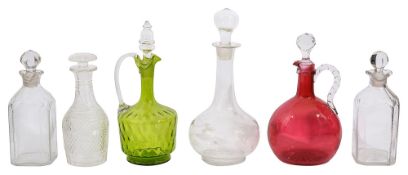 A pair of George III cut glass spirit decanters and stoppers, other later decanters and claret jugs