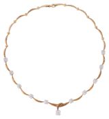 A flexible link and diamond-set cluster necklace