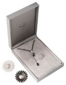 A Lalique glass pendant together with two Georg Jensen brooches