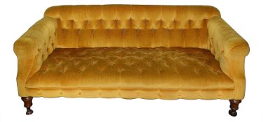 A Victorian walnut and upholstered sofa
