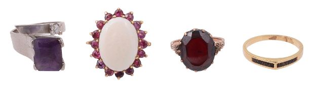 An amethyst and diamond platinum ring, a 9ct opal ring, a red stone ring and another