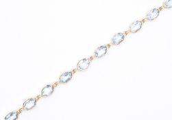 9CT GOLD & AQUAMARINE LINE BRACELET