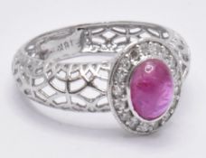 18CT WHITE GOLD CABOCHON BURMA RUBY & DIAMOND HALO RING