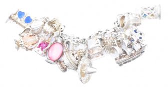 ASSORTMENT OF SILVER CHARMS