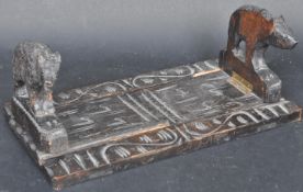 EARLY 20TH CENTURY GERMAN BLACK FOREST EBONISED WOOD BOOKSLIDE