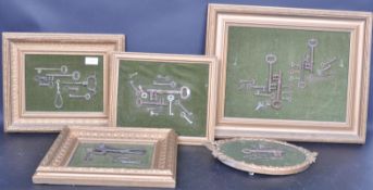 COLLECTION OF MOUNTED VINTAGE CAST IRON KEYS