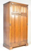 1940'S OAK CARVED DOUBLE DOOR LINEN FOLD PATTERN WARDROBE