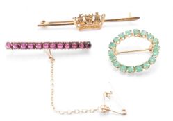 THREE 9CT GOLD BROOCHES INCLUDING GARNET & EMERALD