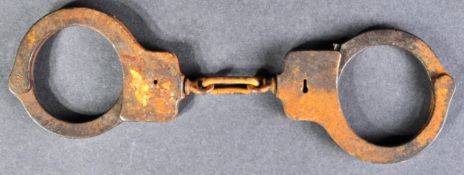 PAIR OF EARLY 20TH CENTURY PEERLESS HANDCUFF CO. HANDCUFFS