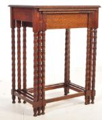An Edwardian early 20th century oak nest of graduating tables having beaded decoration to the edge