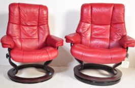 EKORNES - STRESSLESS - TWO RETRO ARMCHAIRS IN RED LEATHER