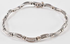 A WHITE GOLD AND DIAMOND TENNIS BRACELET