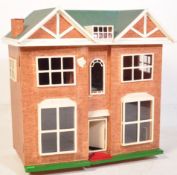 A RETRO VINTAGE FOUR BEDROOM DOLLS HOUSE