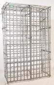 A LARGE INDUSTRIAL WALL METAL WIRE BOTTLE / WINE RACK