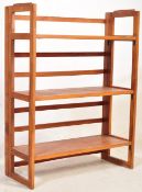 A RETRO VINTAGE 20TH CENTURY FOLDING TEAK BOOKSHELF