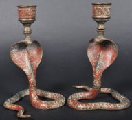PAIR OF EARLY 20TH CENTURY INDIAN BRASS COBRA CANDLESTICKS