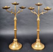 PAIR OF 19TH CENTURY GOTHIC BRASS TRIPLE CANDLESTICKS
