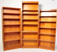 A SERIES OF THREE VINTAGE TEAK MODULAR BOOKCASES