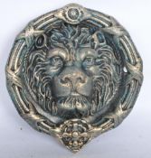 A 20TH CENTURY CAST IRON HEAD SHAPED DOOR KNOCKER