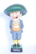 A VINTAGE CAST IRON THE PENFOLD MAN ADVERTISING STATUE