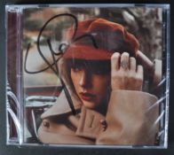 TAYLOR SWIFT - SINGER - AUTOGRAPHED ' RED ' CD - AFTAL