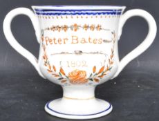 AN EARLY 19TH CENTURY TWIN HANDLED FROG CREAMWARE CUP