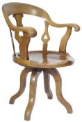 19TH CENTURY ARTS AND CRAFTS MAHOGANY REVOLVING ARMCHAIR