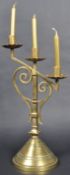 LATE 19TH CENTURY GOTHIC POLISHED BRASS TRIPLE CANDLESTICK