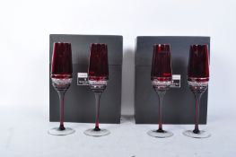SET OF FOUR JOHN ROCHA FOR WATERFORD CRYSTAL RUBY FLUTE GLASSES
