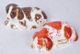 TWO ROYAL CROWN DERBY BONE DOG CHINA PAPERWEIGHTS