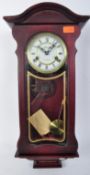 A LINCOLN 31 DAY MAHOGANY WALL CLOCK