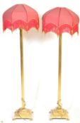 PAIR OF BRASS NEO CLASSICAL HAIRY PAW STANDARD FLOOR LAMPS