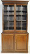 AN EDWARDIAN OAK GLAZED BOOKCASE