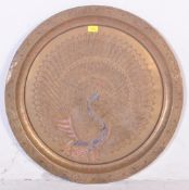 A LARGE BRASS PEACOCK CHARGER / PLATE