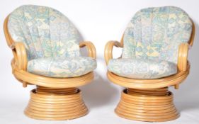 MATCHING PAIR OF BAMBOO SWIVEL EGG EASY LOUNGE ARMCHAIRS