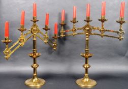 PAIR OF MID 19TH CENTURY GOTHIC BRASS ARTICULATED CANDLESTICKS