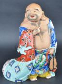 20TH CENTURY POTTERY LAUGHING BUDDHA FIGURINE