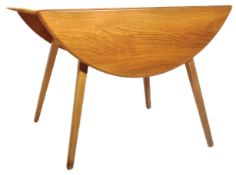 ERCOL - A MID CENTURY BEECH AND ELM TOPPED DINING TABLE