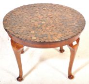 VINTAGE WALNUT AND COIN TOPPED COFFEE TABLE
