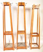 MATCHING PAIR OF MID CENTURY OAK FRAMED COAT HOOKS